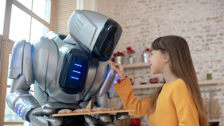 Robots culinaires : la révolution futuriste qui pourrait bouleverser votre cuisine Un robot sert à manger à une petite fille.